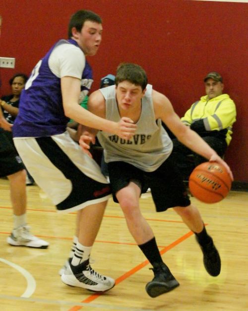 Wiley Hesselgrave drives hard to the hoop.