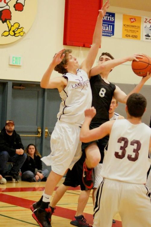 Aaron Trumbull fends off a defender while looking for a bucket.