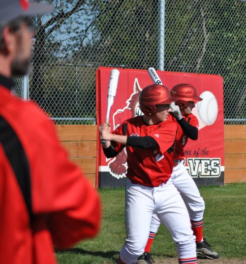 Drew Chan (left) and Kurtis Smith get ready under the watchful eye of assistant coach Mike Etzell.