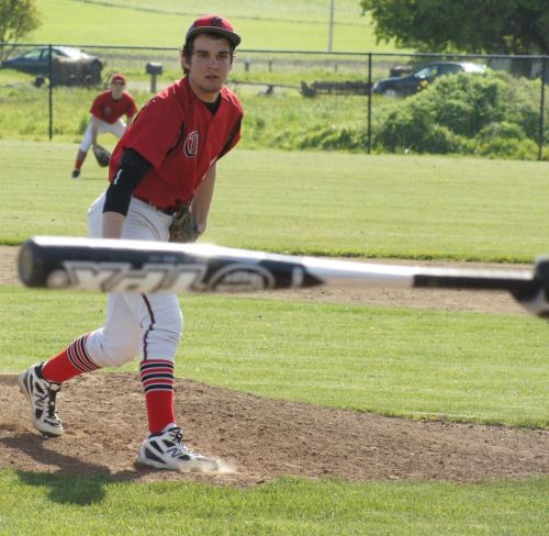 Ben Etzell stares at a Sultan bat which has just missed another one of his pitches.