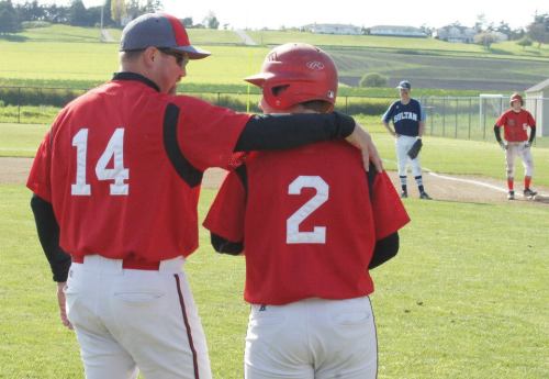 Willie Smith imparts some last bits of wisdom to senior Drew Chan. (Shelli Trumbull photos)