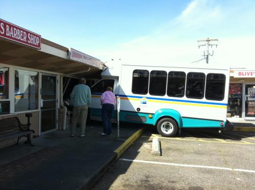 A rogue Island Transit bus takes a bite out of En Vouge Hair Salon. (Spencer Hawkins photo)