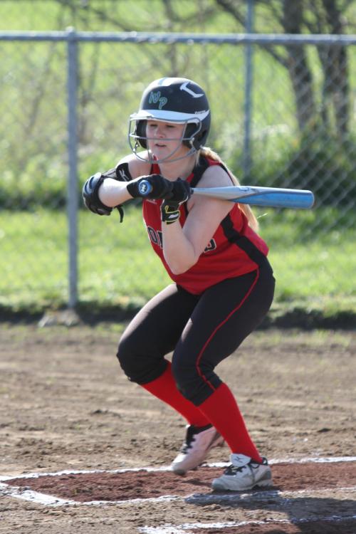 Madeline Roberts, proving she can hit with her eyes shut here in a earlier game, delivered one of Coupeville's three hits Tuesday. (John Fisken photo)