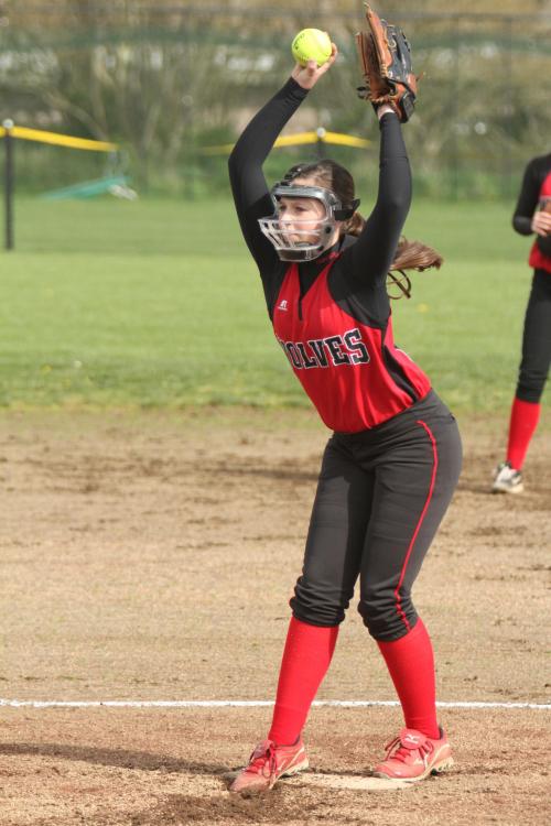 McKayla Bailey threatens to throw out her back, while the waiting batter waits and prays.