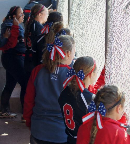 Alexis Trumbull (8) and teammates sport the red, white and blue.