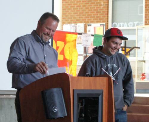 Drew Chan (right) and Wolf coach Willie Smith share a light moment at the team banquet. (Shelli Trumbull photo)