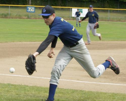 Aaron Curtin guards the line at third.