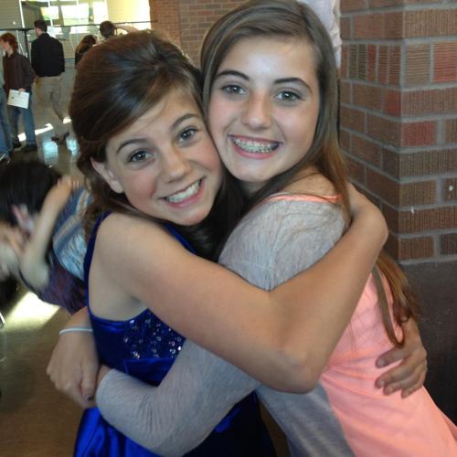 Jae and big sister Micky celebrate during the 8th grade graduation.