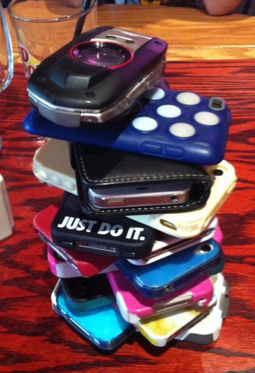The leaning tower of cell phones, as the players enjoy a Red Robin break.