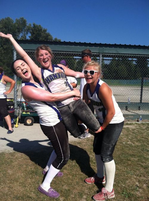 Madeline Roberts touches the sky, with a little help from teammates Emma Seymer (left) and Madeline Strasburg.