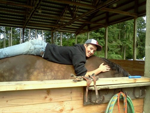 A cowboy and his horse.