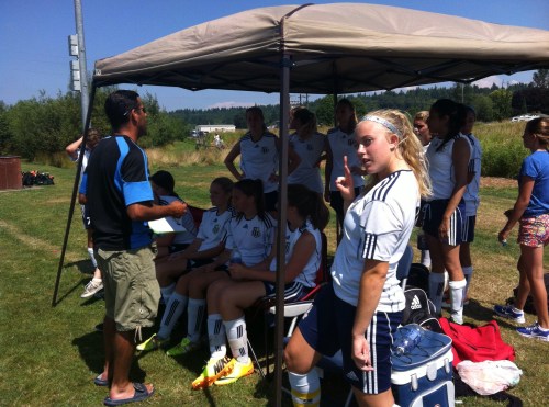 Kenzie Perry photo-bombs Sean LeVine's halftime speech. 