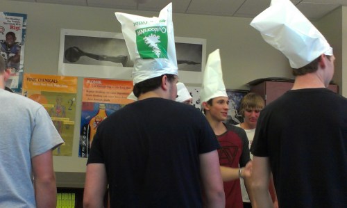 Coupeville High School seniors work on assembling goodie bags for the runners.