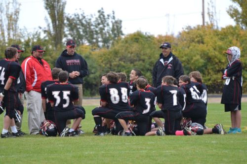 Coupeville Middle School coaches and players hold a conference last season. (Marie Fleming photos)