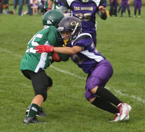 Ty Eck holds the line while playing youth football for the Oak Harbor Pumas. (John Fisken photos)