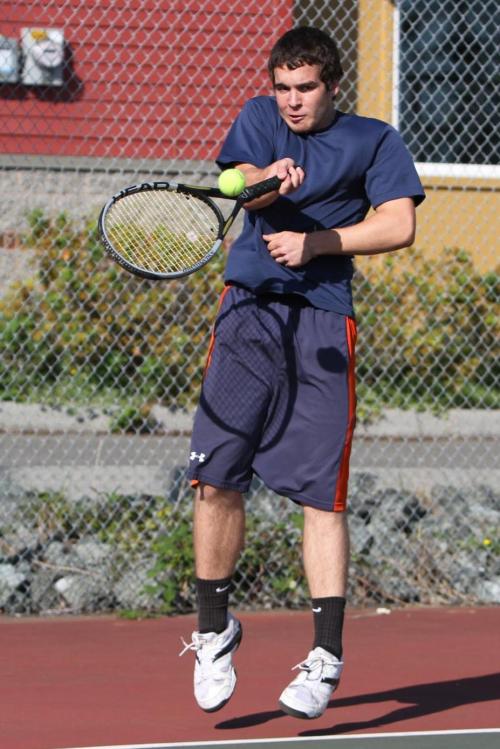 Ben Etzell gets twisted around, but still makes the volley.