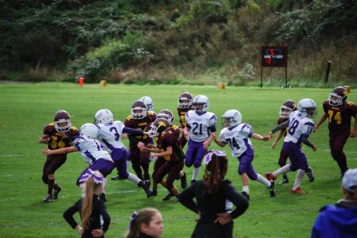 A flock of Sea Hawks descends on a Lakewood runner.
