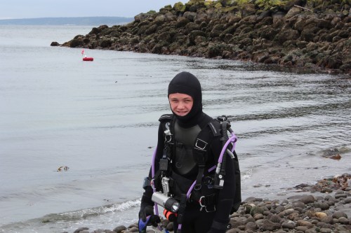 Grey Rische emerges from the water.