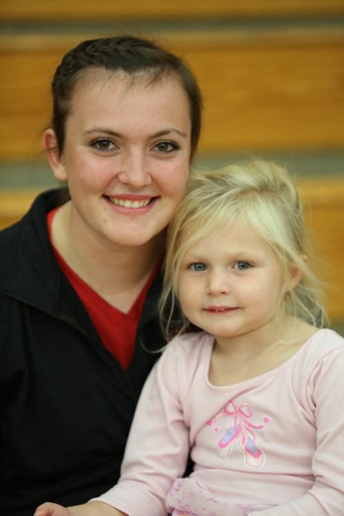 Big-hitting Wolf junior Hailey Hammer (left) and one of her many fans.