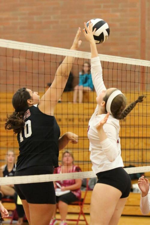 Engle out-jumps a Cedarcrest player.