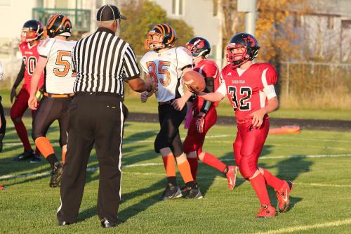 Martin hands the ball tot he ref after scoring the game's first touchdown.