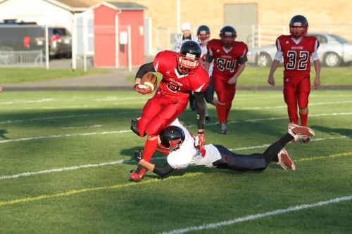 Cole Payne gets tripped up as he tries to scramble for big yardage.