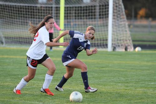 Marisa Etzell (left) shadows the play in an earlier-season game. (John Fisken photo)