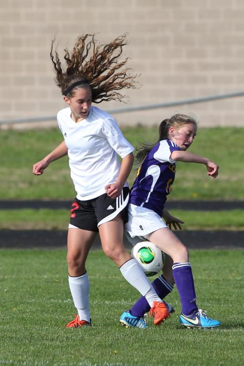 Marisa Etzell's secret weapon: hair. Lots 'n lots of hair.