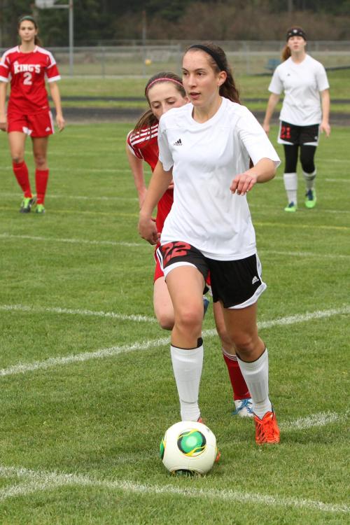Marisa Etzell looks for help as she charges up-field.