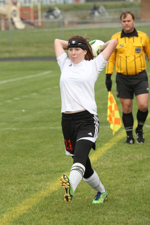 Wolf captain Jacki Ginnings launches the ball into play.