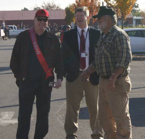 Longtime Wolf coach Larrie Ford (left) hangs out with a quality crowd.
