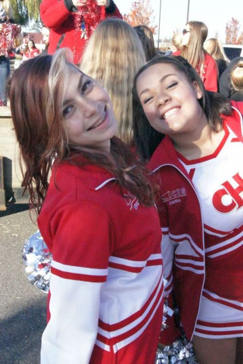 Even after running the parade route, CHS cheerleaders can still smile.