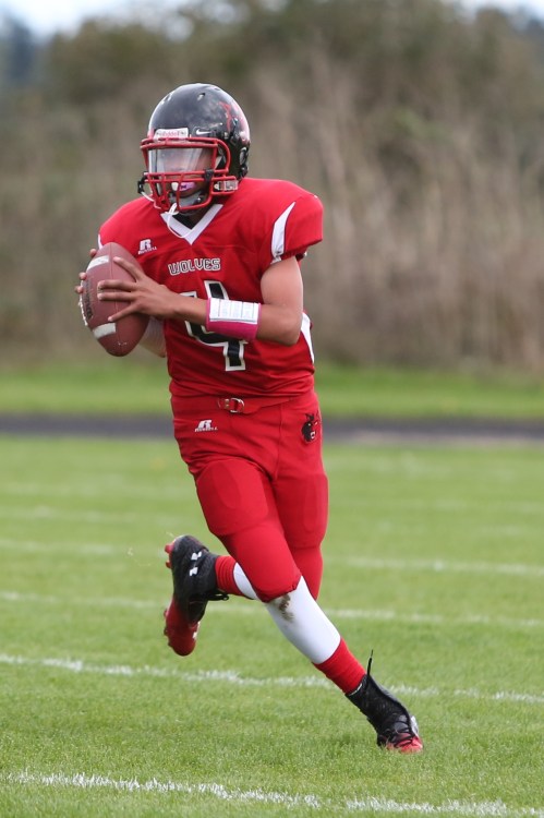 Wolf QB Ramon Booker looks for a crack in the defense.
