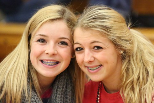 Kacie (left) and former Wolf volleyball player Katie Kiel share a sisterly moment.