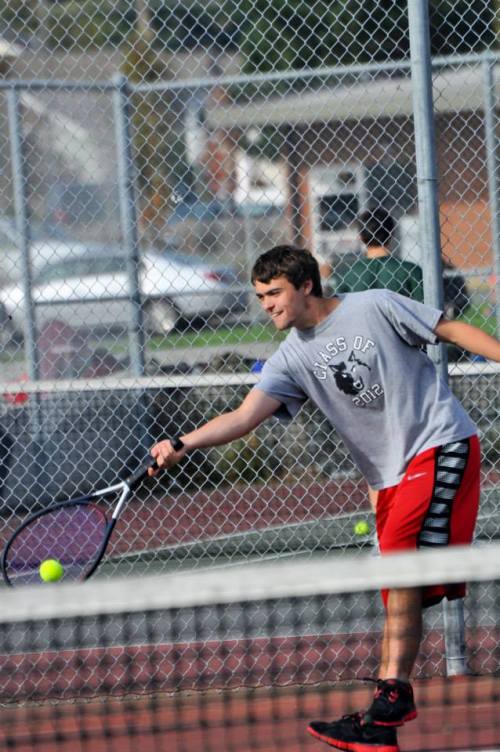 Brian Norris takes a break from swatting killer bees to deliver a winning ground stroke. (Lorene Norris photos)