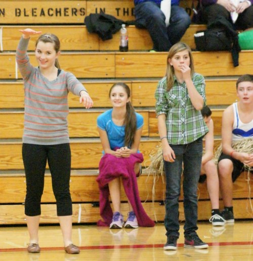 Freshmen Valen Trujillo (left) and Jae LeVine coach their squad. (ST)