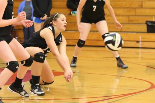 McKenzie Bailey goes low for the bump.