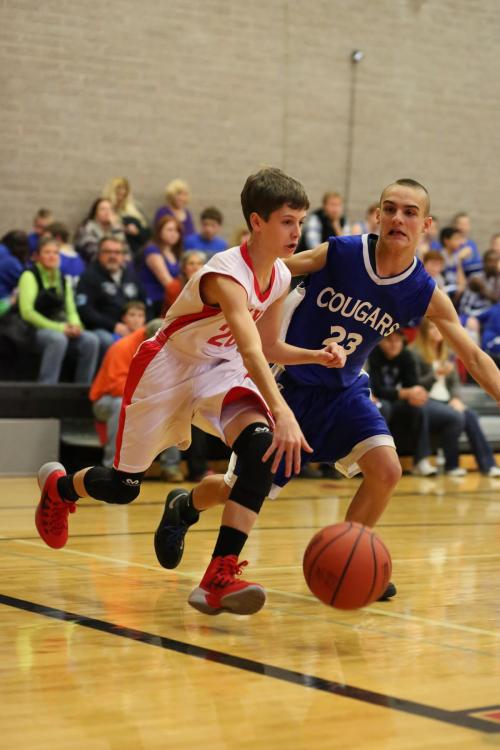 Luke Merriman looks to turn the corner on a Langley defender.