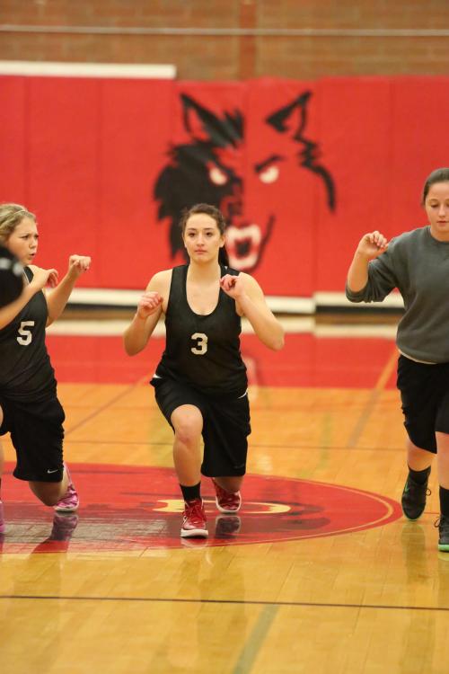 Breeanna Messner (5) feels the burn, as she joins Amanda Fabrizi (3) and McKayla Bailey in some stretches.