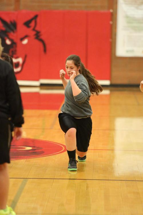 Wolf junior McKayla Bailey limbers up. Never photo bomb your teammates without first stretching.