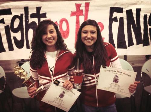 Sisters Kiara Mercedes (left) and Kylie Marie, with their cheer awards.