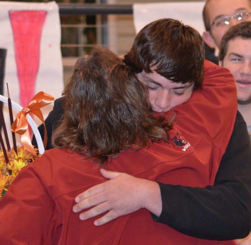 Defensive MVP Nick Streubel gives mom Nanette a hug.