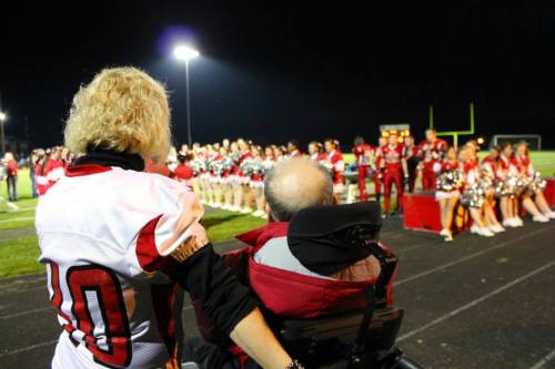 Sylvia and Garrett Arnold wait to go on the field with their son Brett. (Courtney Arnold photo)
