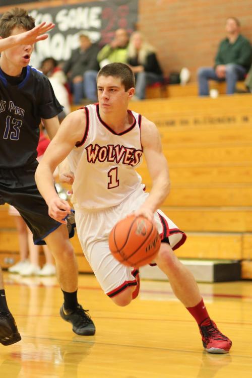 Wiley Hesselgrave drives hard to the hoop. (John Fisken photo)