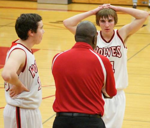 Aaron Trumbull (left) and Morgan Payne listen to Wolf coach Anthony Smith. (Shelli Trumbull photo)