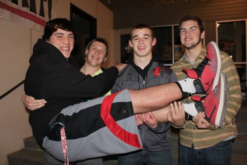 Nick Streubel (left) is held by by Wolf teammates (l to r) Brett Arnold, Jake Tumblin and Aaron Wright. (Sylvia Arnold photo)