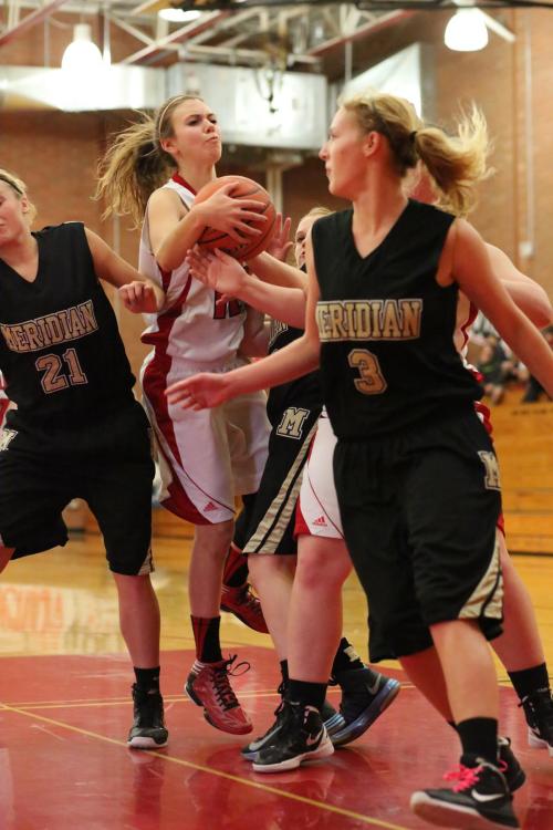 Julia Myers, seen here being a beast on the boards in an earlier game, hauled down ? boards Tuesday. (John Fisken photo)