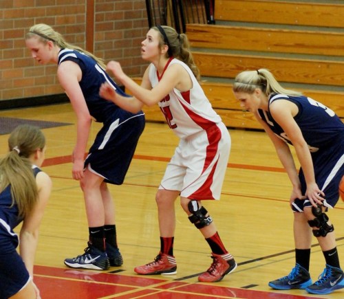 Julia Myers (middle), seen here on opening night, was relentless on defense Saturday afternoon. (Shelli Trumbull photo)