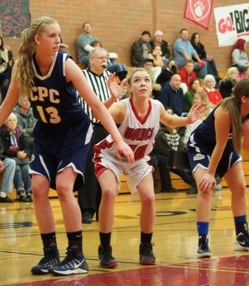 Kacie Kiel prepares to launch in pursuit of a rebound.