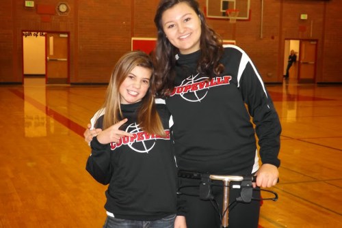 Team manager Jae LeVine (left) checks in on injured Wolf Miranda Engle (hence the scooter).